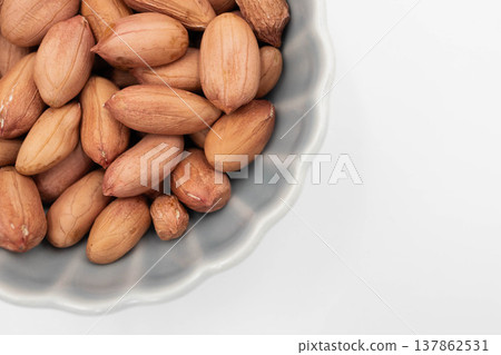 Close-up of a peanut, white background, with copy space, nut material. Close-up of a peanut, white background, with copy space, nut material. 137862531