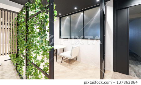 A semi-private meeting space surrounded by houseplants A semi-private meeting space surrounded by houseplants 137862864
