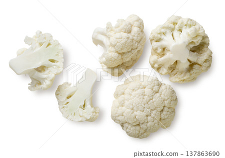 Cauliflower pieces close up on a white. Top view Cauliflower pieces close up on a white. Top view 137863690