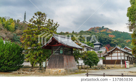 Taima-dera Temple in autumn foliage: Japan's oldest temple bell, the national treasure East Pagoda, and the national treasure West Pagoda. December 8, 2025. 137863830