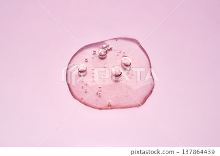 Pink cosmetic serum flowing with bubbles abstract Pink cosmetic serum flowing with bubbles abstract 137864439
