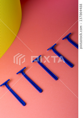 Shaving razors on a colored background Shaving razors on a colored background 137864488