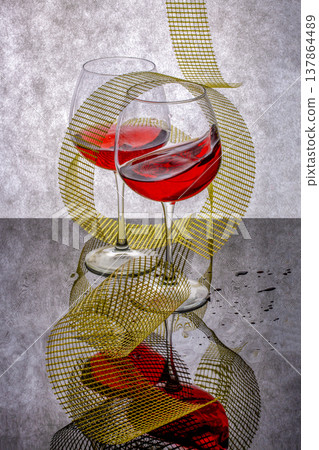 Still life with glass goblets on a gray-black background Still life with glass goblets on a gray-black background 137864489