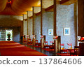 The elegant hotel lobby features beautiful stone pillars and a red carpet. 137864606