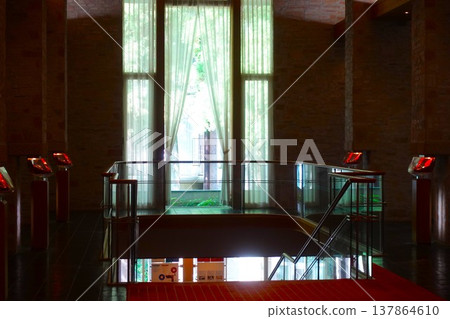 The hotel's stairwell is elegant, with stone walls and red accents. The hotel's stairwell is elegant, with stone walls and red accents. 137864610