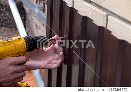 Repair of the foundation and walls of the house with the installation of metal sheets on the frame for finishing the basement. 137864771