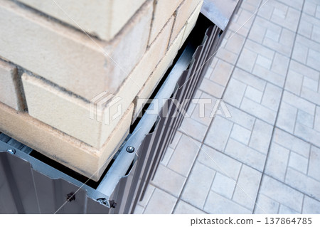 Repair of the foundation and walls of the house with the installation of metal sheets on the frame for finishing the basement. Repair of the foundation and walls of the house with the installation of metal sheets on the frame for finishing the basement. 137864785