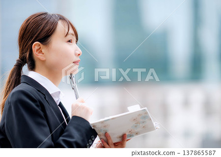 A woman in a suit A woman in a suit 137865587
