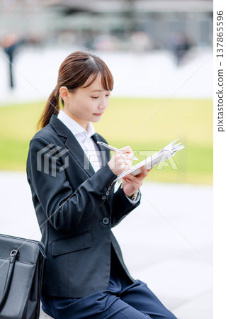 A woman in a suit A woman in a suit 137865596