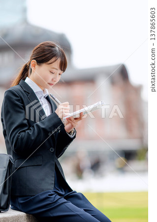 A woman in a suit A woman in a suit 137865603