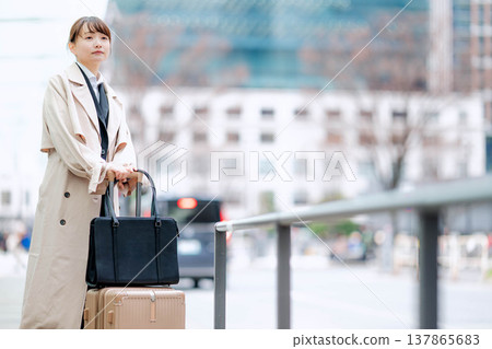 A young businesswoman waiting for a taxi in the city. 137865683