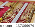 The depth of the neatly arranged gold-framed eye examination lenses evokes an image of precise vision adjustment and advanced technology. 137866079