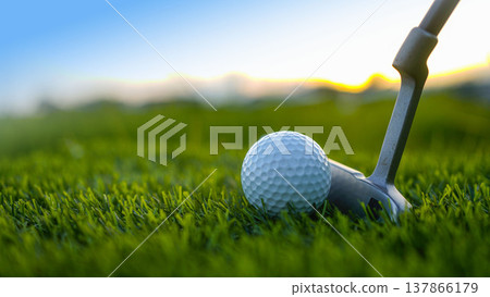 Golf clubs and balls on a green lawn in a beautiful golf course with morning sunshine. 137866179