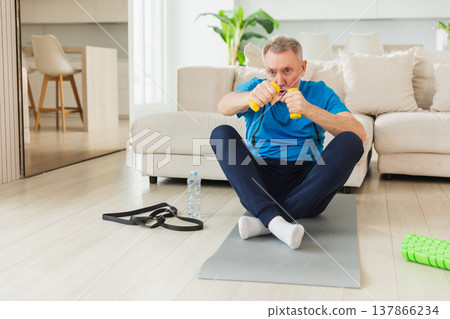 Fitness workout training. Senior man boxing punching picking up dumbbells. Old adult mature healthy man doing sports exercise at home. Grandfather have workout rehabilitation. Health care healthy Fitness workout training. Senior man boxing punching picking up dumbbells. Old adult mature healthy man doing sports exercise at home. Grandfather have workout rehabilitation. Health care healthy 137866234