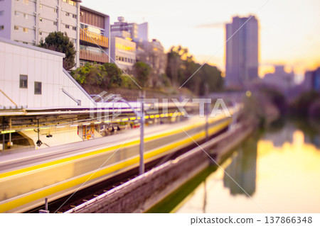 Evening view of JR Ichigaya Station and Ichigaya Outer Moat in Tokyo, using a shift lens with reverse tilt-shift. Evening view of JR Ichigaya Station and Ichigaya Outer Moat in Tokyo, using a shift lens with reverse tilt-shift. 137866348