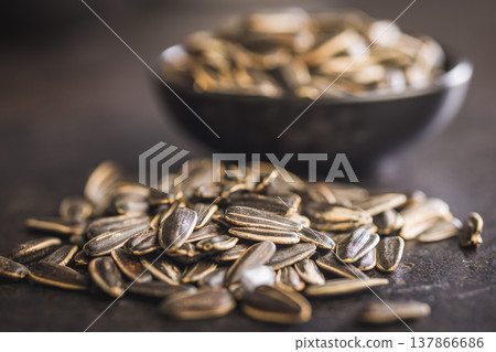 Close-Up Pile Of Sunflower Seeds In Bowl, Roasted Snack And Plant-Based Protein Close-Up Pile Of Sunflower Seeds In Bowl, Roasted Snack And Plant-Based Protein 137866686