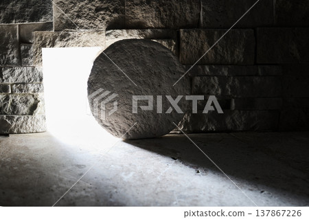 Empty tomb with stone rolled away and bright light Empty tomb with stone rolled away and bright light 137867226