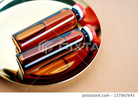 Medicine vials on a golden tray preparing for treatment 137867645