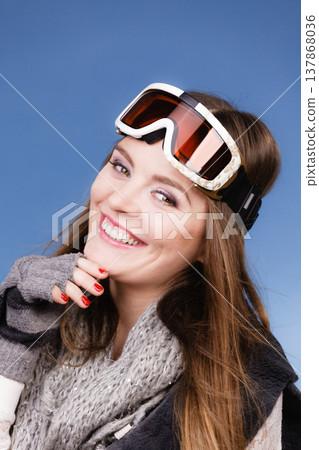 skier girl wearing warm clothes ski googles portrait. skier girl wearing warm clothes ski googles portrait. 137868036