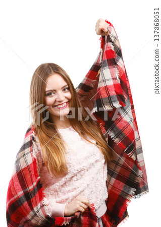 Woman wearing warm scarf warming herself up 137868051