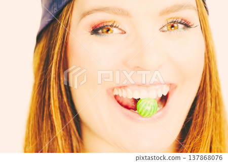 Attractive girl chewing gum. Attractive girl chewing gum. 137868076