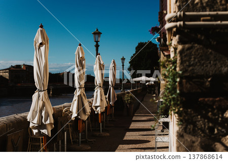 Closed cafe on a street near Adidge river, Verona, Italy. 137868614