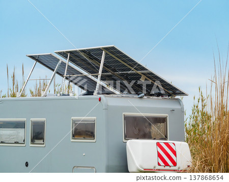 Caravan with tilt solar panels on roof. Caravan with tilt solar panels on roof. 137868654