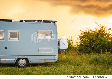 Sunset sky over caravan camping on nature. Sunset sky over caravan camping on nature. 137868675