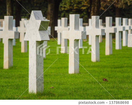St. Mihiel American Cemetery in Thiaucourt France. White crosses and gravestone with a star of David St. Mihiel American Cemetery in Thiaucourt France. White crosses and gravestone with a star of David 137868698