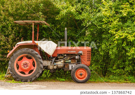 Tractor working on the farm Tractor working on the farm 137868742