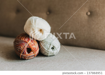 Skeins of woolen yarn for hand knitting. Natural colors. Concept for handmade. Skeins of woolen yarn for hand knitting. Natural colors. Concept for handmade. 137868951