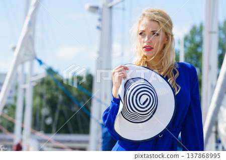Fashion model wearing blue jumpsuit Fashion model wearing blue jumpsuit 137868995