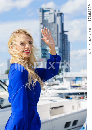 Fashion model wearing blue jumpsuit Fashion model wearing blue jumpsuit 137868999