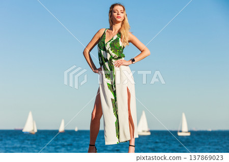 Fashion woman against sea. Fashion woman against sea. 137869023