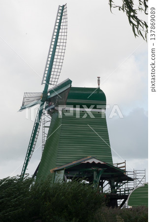 Traditional wooden wildmill at Zaanse Schans, Zaandam, Netherlands 137869089
