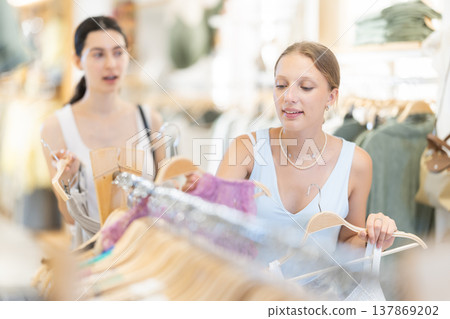 Women choose clothes in the summer Women choose clothes in the summer 137869202