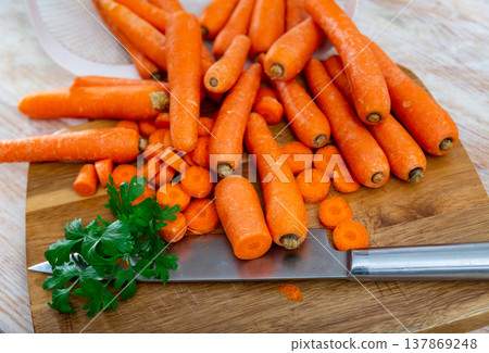 Whole and sliced raw carrot on table Whole and sliced raw carrot on table 137869248