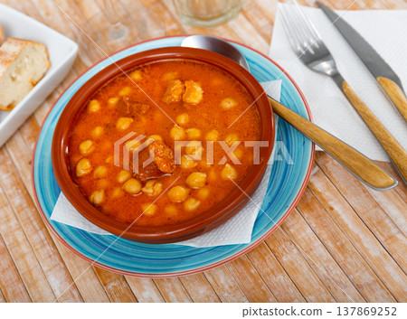 Garbanzos a la Riojana, chickpea stew with bacon, chorizo, vegetables Garbanzos a la Riojana, chickpea stew with bacon, chorizo, vegetables 137869252