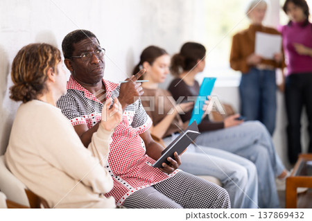 man in the waiting list for an interview in the office 137869432