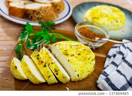Fried cottage cheese with turmeric. Traditional Lithuanian dish Fried cottage cheese with turmeric. Traditional Lithuanian dish 137869465