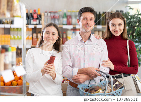 Family with teenage girl doing shopping in grocery Family with teenage girl doing shopping in grocery 137869511