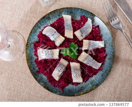 On pillow of beetroot salad - pieces of lightly salted herring are arranged in circle On pillow of beetroot salad - pieces of lightly salted herring are arranged in circle 137869577