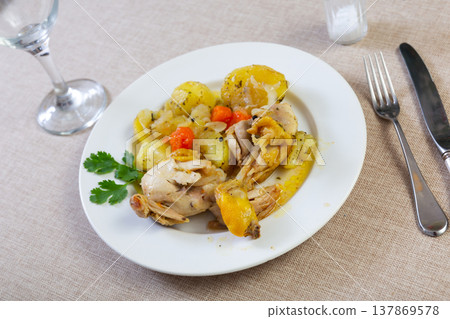 Homemade fried chicken legs with garnish of boiled potatoes 137869578