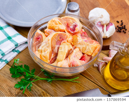 Pieces of unprepared chicken on table Pieces of unprepared chicken on table 137869594