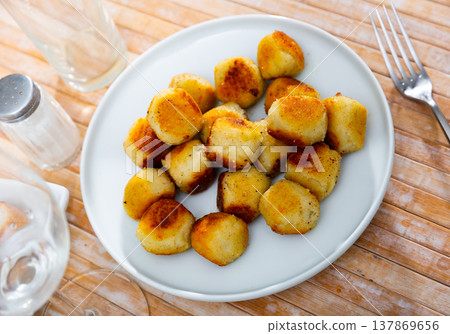 Fried cheese croquettes with crispy crust and soft filling 137869656