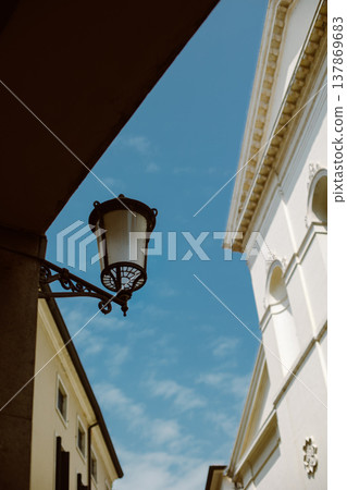 Beautiful old street in Padova, Italy. Amazing blue sky. 137869683