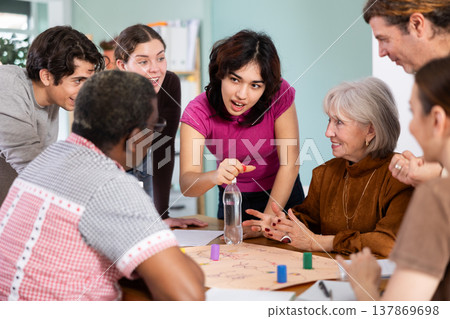 Group of people playing board game 137869698
