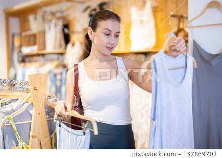 Woman shopping in a boutique Woman shopping in a boutique 137869701