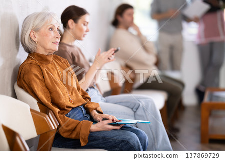 People are sitting in line and waiting for an interview 137869729