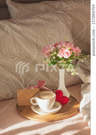 Romantic Breakfast in Bed with Coffee and Flowers. Romantic Breakfast in Bed with Coffee and Flowers. 137869764
